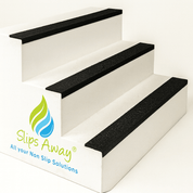 Three white steps with black GRP nosing and Slips Away logo on a white background