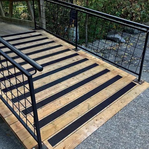 Black GRP anti slip cleats strips on ramps, walkways, stairs and steps
