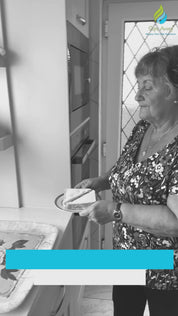 video showing elderly lady applying anti slip tape mat  to food tree to avoid slipping