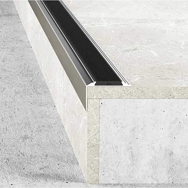 Close-up of a concrete floor with a aluminium rubber stair nosing