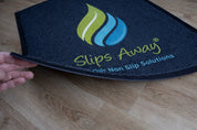 Slips Away non-slip solution mat on a wooden floor