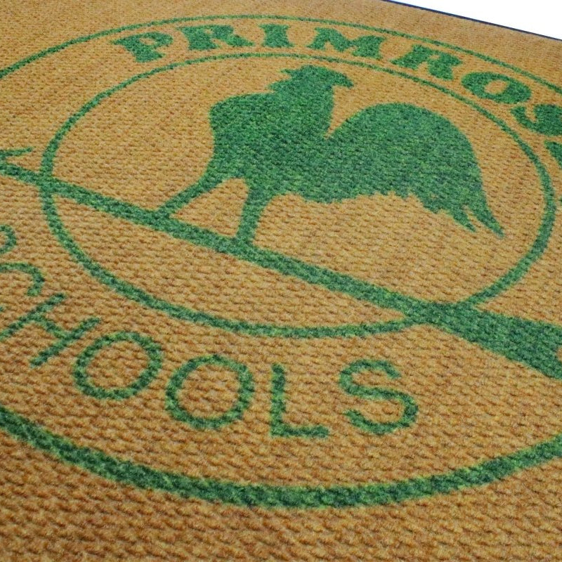 close up of Logo of Primrose Schools on a textured surface with green text and rooster silhouette.