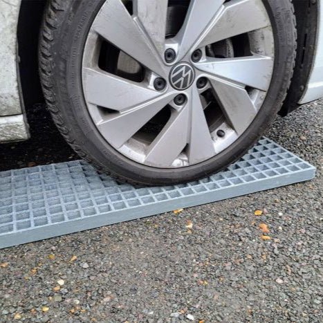 Car wheel on a grey waffle board