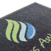 Close-up of a Slips Away promo scrape custom logo entrance mat 