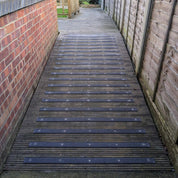 Wooden pathway with black GRP anti slip strips 