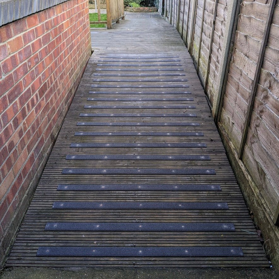 Wooden pathway with black GRP anti slip strips 
