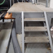 GRP staircase with multiple steps in an industrial setting