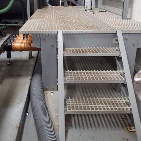 GRP staircase with multiple steps in an industrial setting