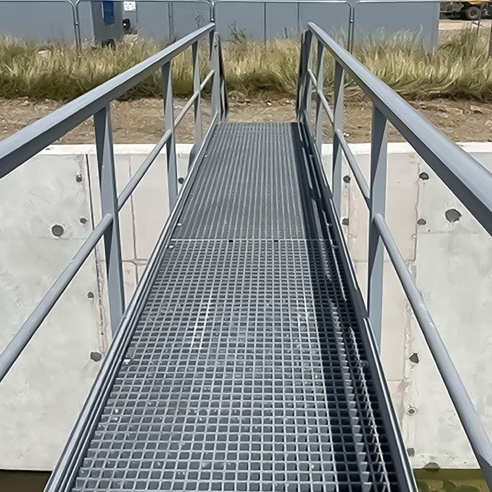GRP staircase leading up to a building with a cloudy sky in the background