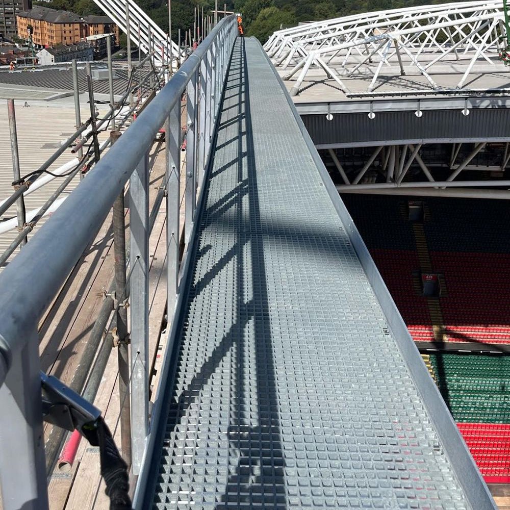 GRP staircase leading up to a stadium with a red roof