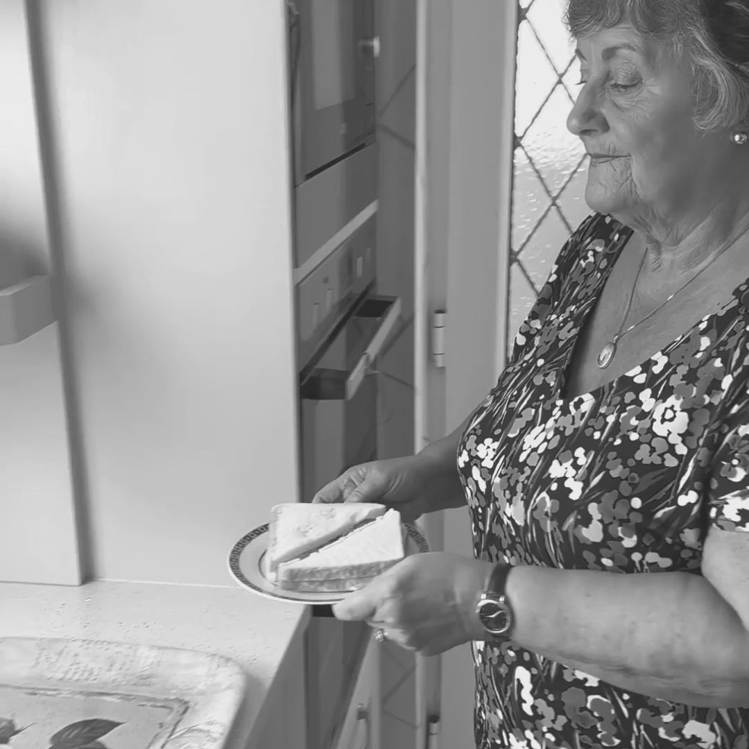 video showing elderly lady applying anti slip tape mat  to food tree to avoid slipping 