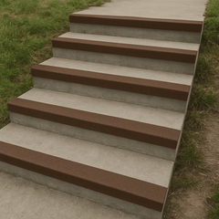 Outdoor concrete steps fitted with brown 55mm GRP anti-slip stair nosing strips, providing durable slip resistance for public walkways, parks, and outdoor spaces.